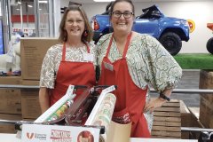 GVC Volunteer Boad Members Smiling at Christmas Wrapping fundraiser 2025