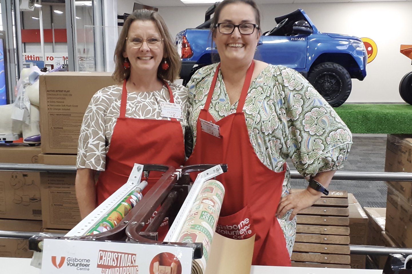GVC Volunteer Boad Members Smiling at Christmas Wrapping fundraiser 2025